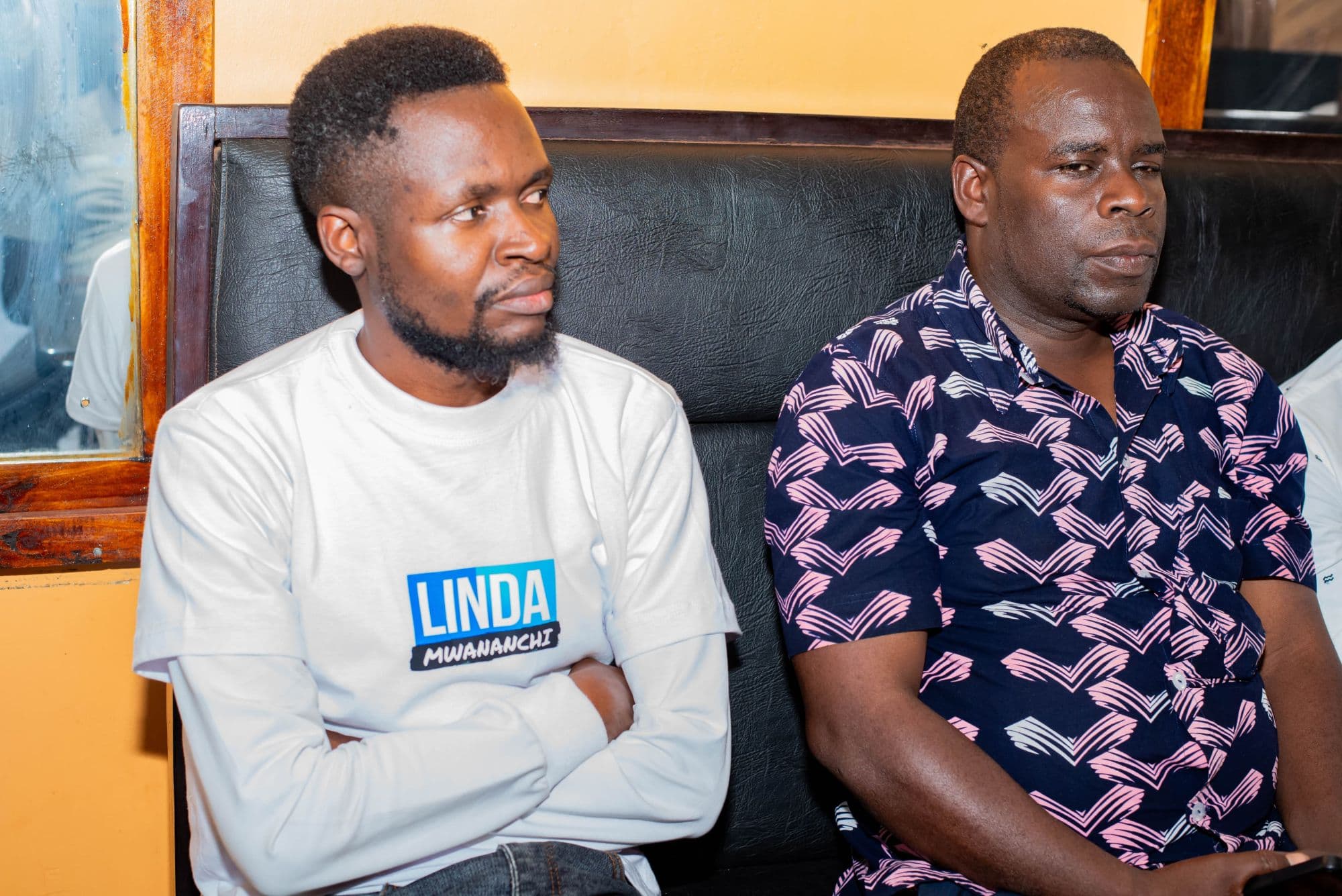 Oburenyi Harrison listening closely during a community meeting